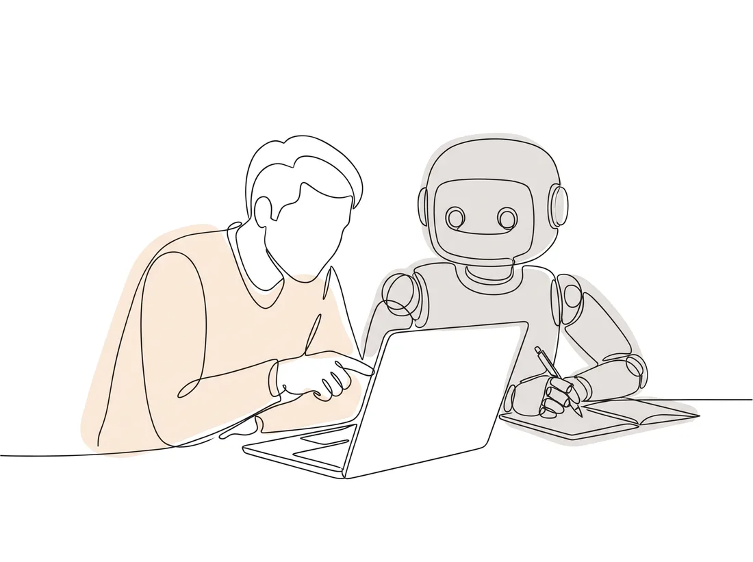 A person and a robot leaning over one laptop together
